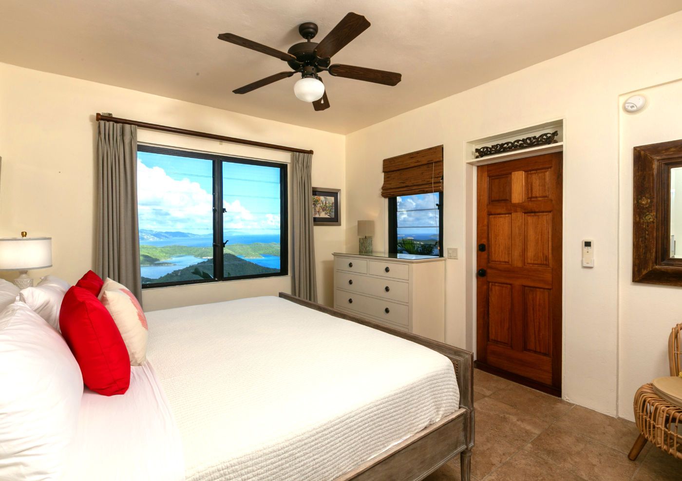 Villa bedroom suite with the down-island view through the window