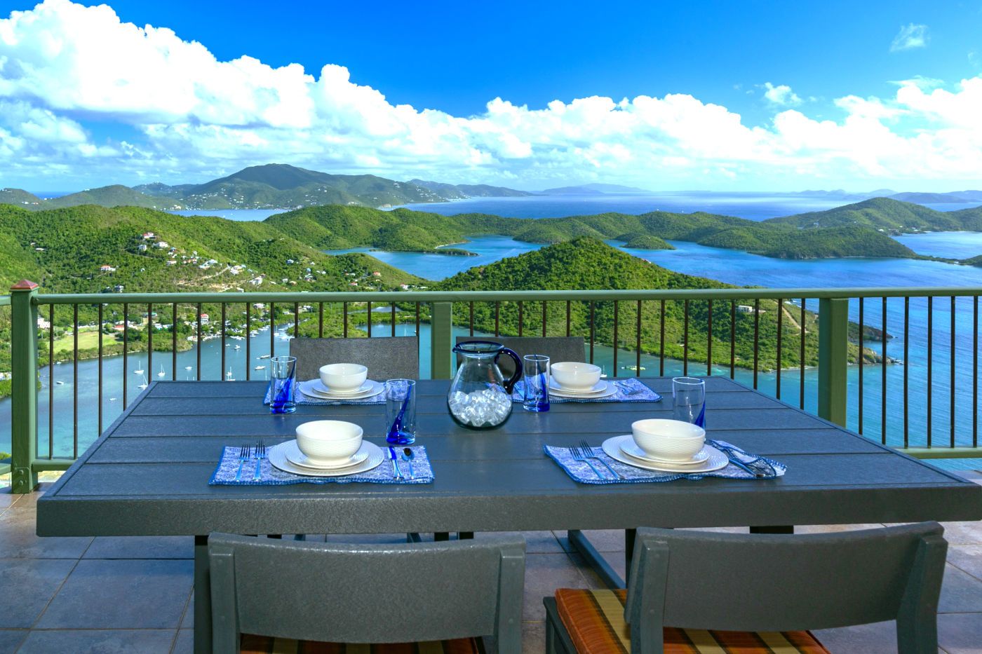 Alfresco dining on the Villa deck, the whole Sir Francis Drake Channel behind it
